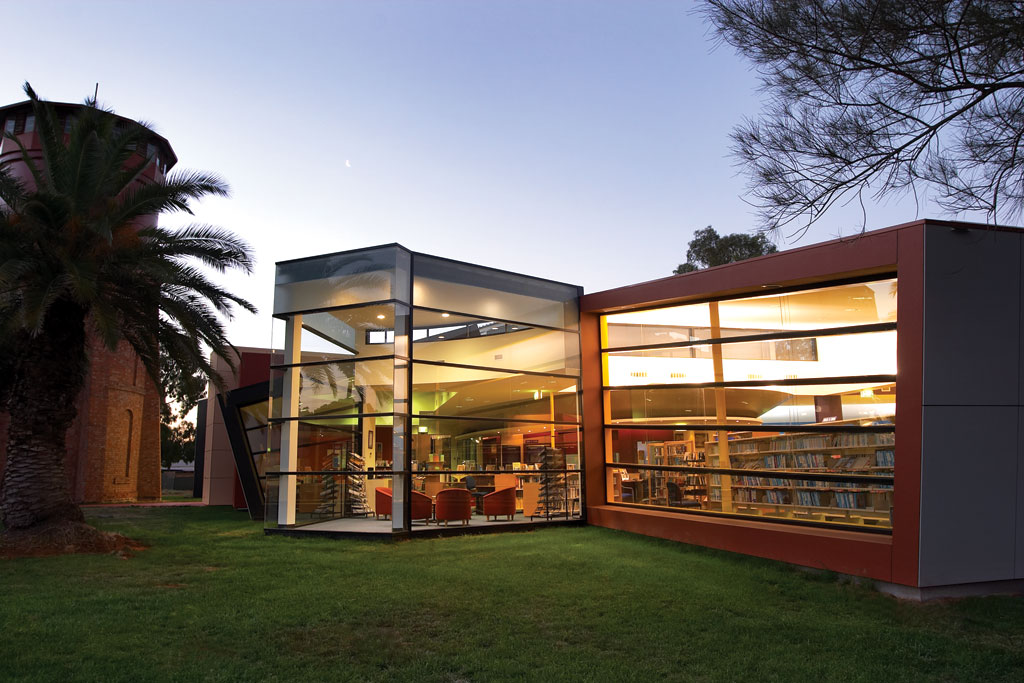 Library building illuminated at dusk